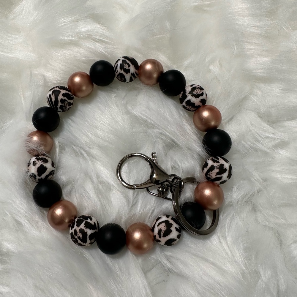 Rose gold cheetah wristlet